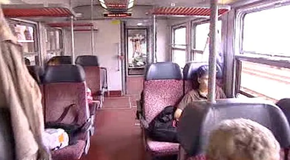 Cestující ve vlaku